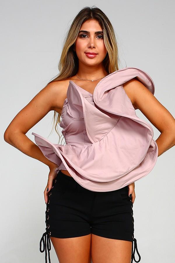a woman in a pink dress holding a cell phone 