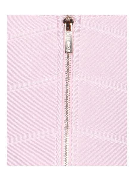 a bathroom with a pink shower curtain in it 