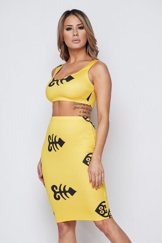 a woman in a yellow bikini holding a surfboard 